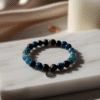The Visionary's Compass bracelet for clarity and creative communication, with Blue Tiger Eye, Apatite, and Obsidian.