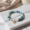 The Ocean's Whisper emotional healing and communication bracelet with pastel Aquamarine, Morganite, and Amazonite beads.