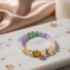 The Abundance Spectrum manifestation bracelet for love and success, with colorful Citrine, Rose Quartz, and Green Aventurine.