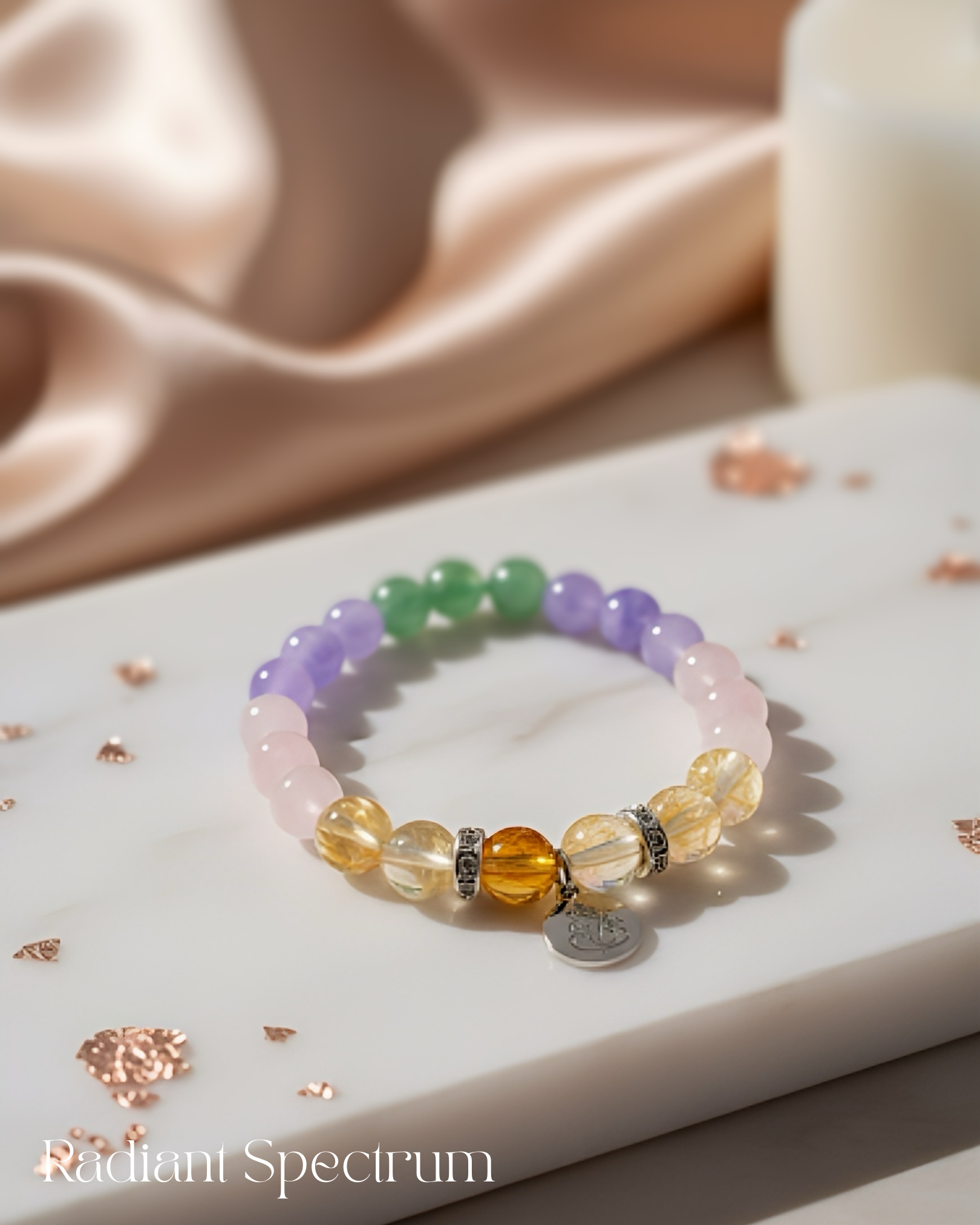 The Abundance Spectrum manifestation bracelet for love and success, with colorful Citrine, Rose Quartz, and Green Aventurine.
